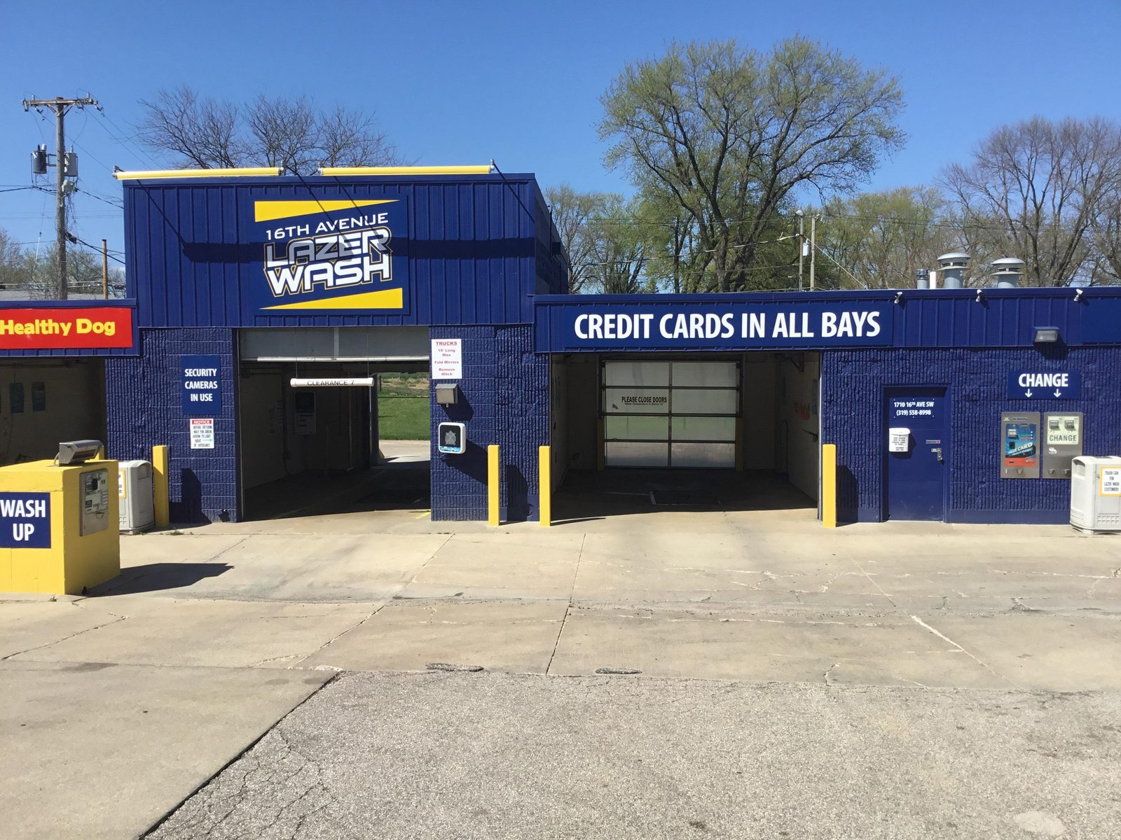 The blue 16th Avenue Lazer Wash building with CREDIT CARDS IN ALL BAYS signage