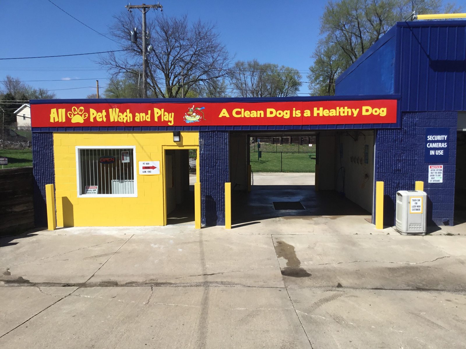 The self-serve dog wash building with an A Clean Dog is a Healthy Dog banner