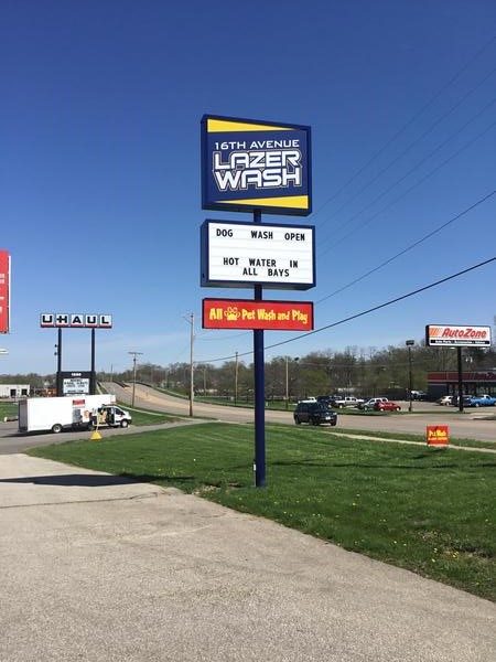 The roadside 16th Avenue Lazer Wash pylon sign on 16th Avenue SW