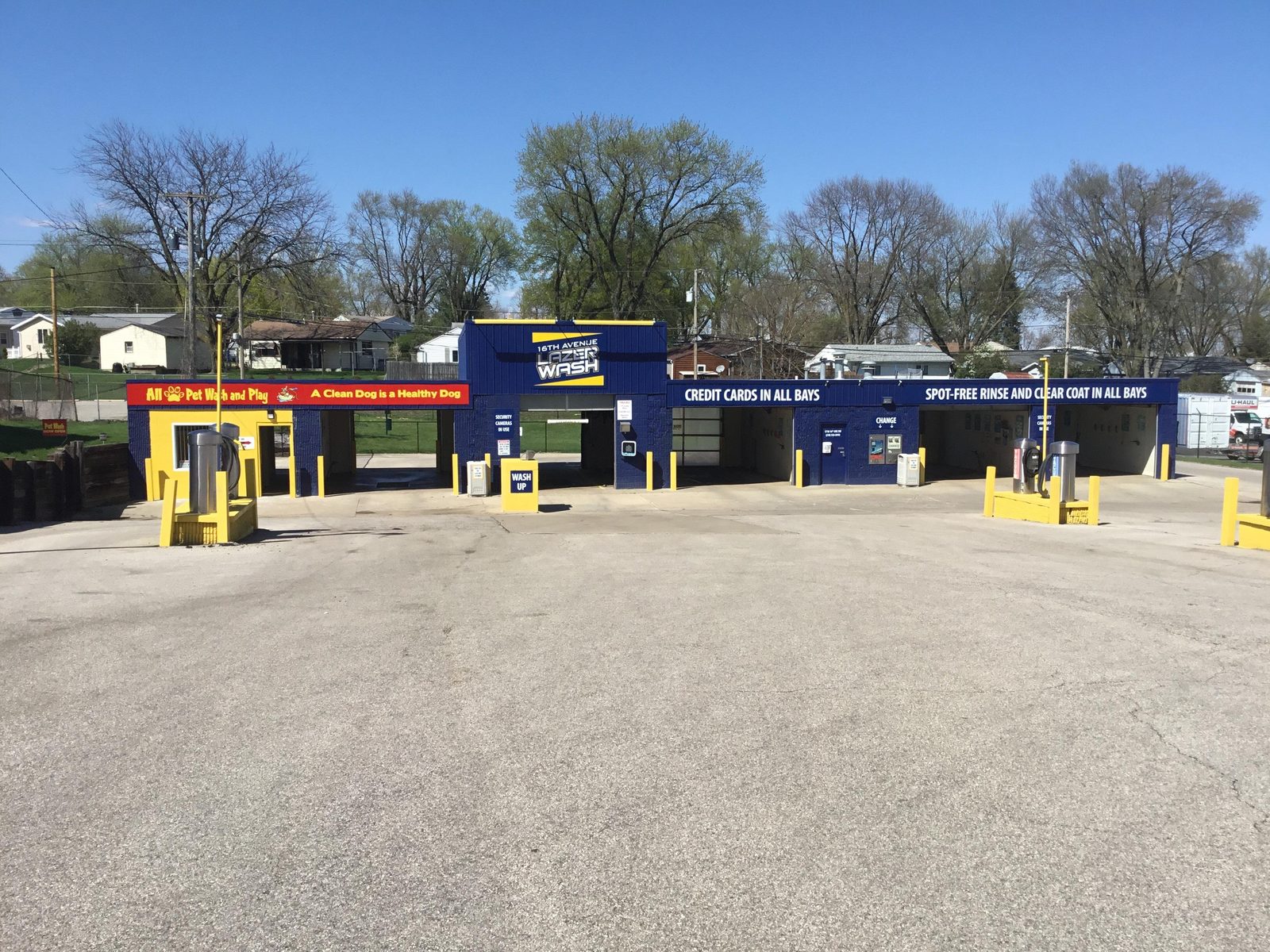 A row of self-serve car wash bays at 16th Ave Lazer Wash